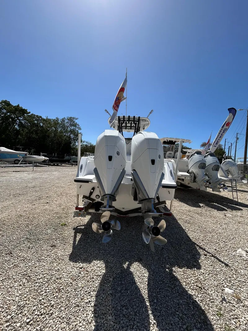 Slide: The Image of 2024 Streamline Ace boat with dual outboard motors in a sunny outdoor setting. - 2