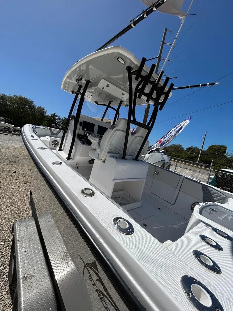 Slide: The Image of 2024 Streamline Ace boat with sleek design and modern features, docked outdoors. - 3