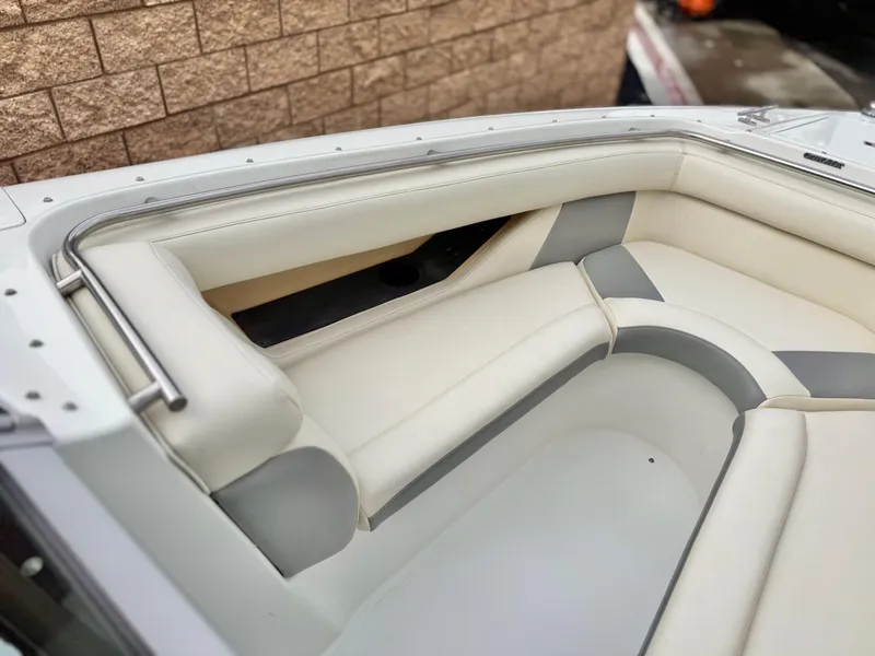 Slide: The Image of Interior seating of a 1994 Cobalt 222 boat with white and gray upholstery. - 10