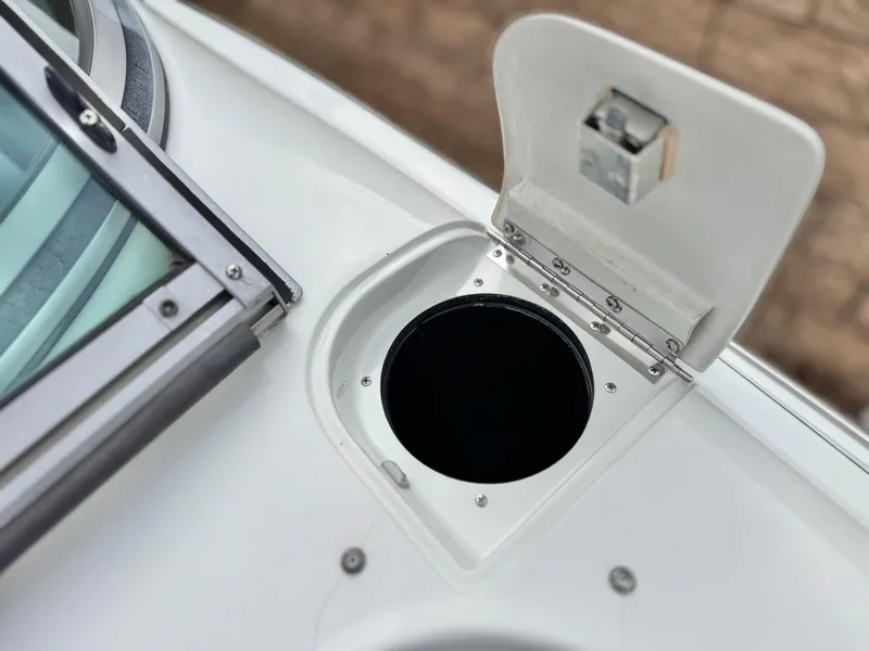Slide: The Image of Open hatch on 1994 Cobalt 222 boat deck, showing circular compartment. - 12