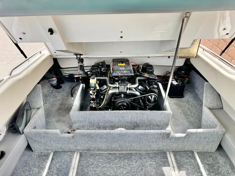 Slide: The Image of Engine compartment of a 1994 Cobalt 222 boat, showcasing the engine and interior layout. - 15