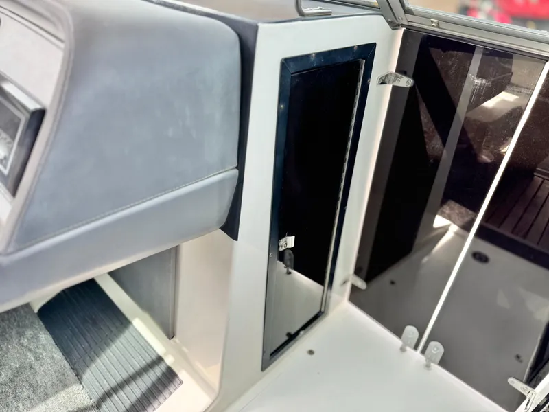 Slide: The Image of Interior of a 1994 Cobalt 222 boat, featuring a sleek cabin design. - 19