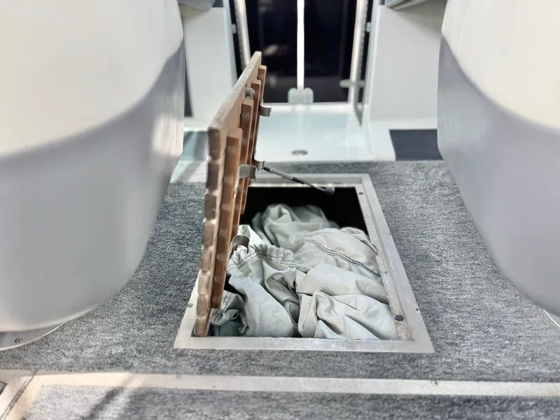 Slide: The Image of Open storage compartment on 1994 Cobalt 222 boat with fabric inside. - 21