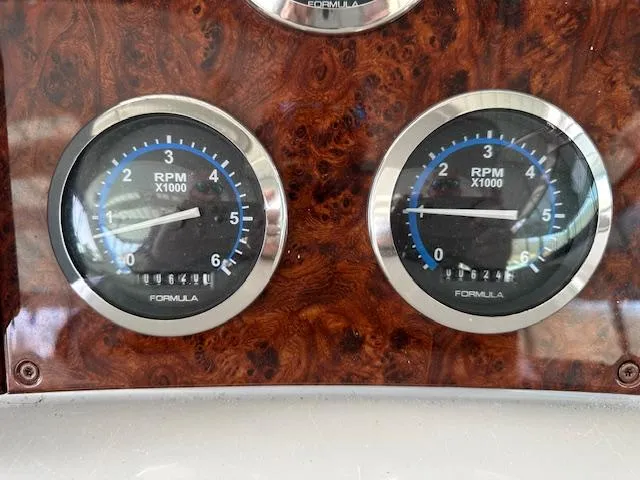 Slide: The Image of Dashboard of 2004 Formula 400 Super Sport with dual RPM gauges. - 11