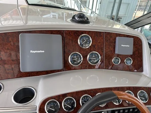 Slide: The Image of Dashboard of a 2004 Formula 400 Super Sport boat with Raymarine displays and gauges. - 13