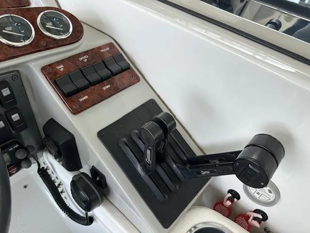 Slide: The Image of Control panel of a 2004 Formula 400 Super Sport boat with throttle levers and gauges. - 14