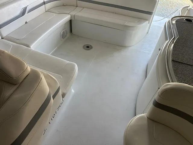 Slide: The Image of Interior of a 2004 Formula 400 Super Sport boat with beige seating. - 2