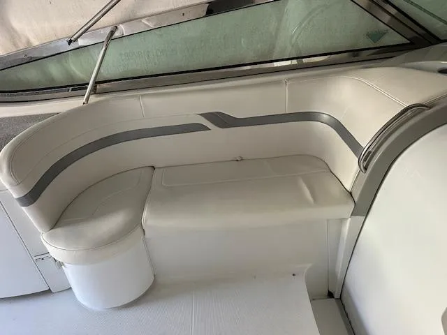 Slide: The Image of 2004 Formula 400 Super Sport boat interior with white seating and sleek design. - 4