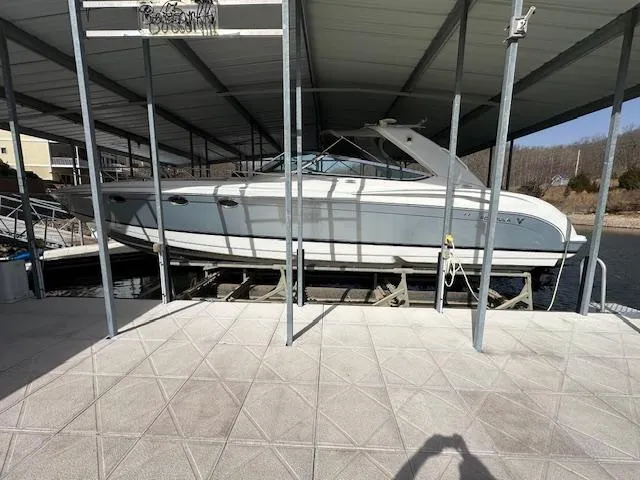 Slide: The Image of 2004 Formula 400 Super Sport boat docked under a covered marina. - 5
