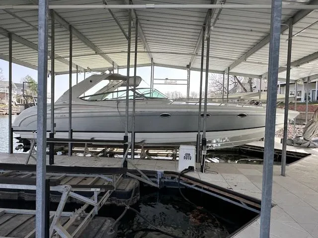 Slide: The Image of 2004 Formula 400 Super Sport boat docked under a covered marina. - 9