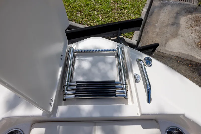 Slide: The Image of 2021 Grady-White 251 Coastal Explorer boat ladder and deck details. - 10