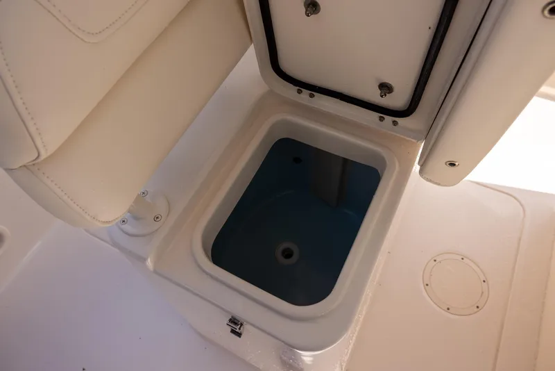 Slide: The Image of 2021 Grady-White 251 Coastal Explorer boat storage compartment open. - 13