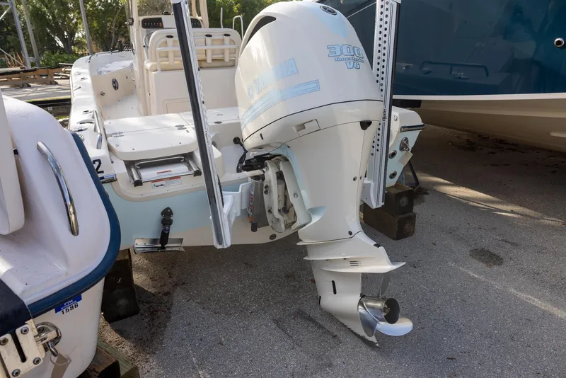 Slide: The Image of 2021 Grady-White 251 Coastal Explorer boat with outboard motor, docked on a sunny day. - 3