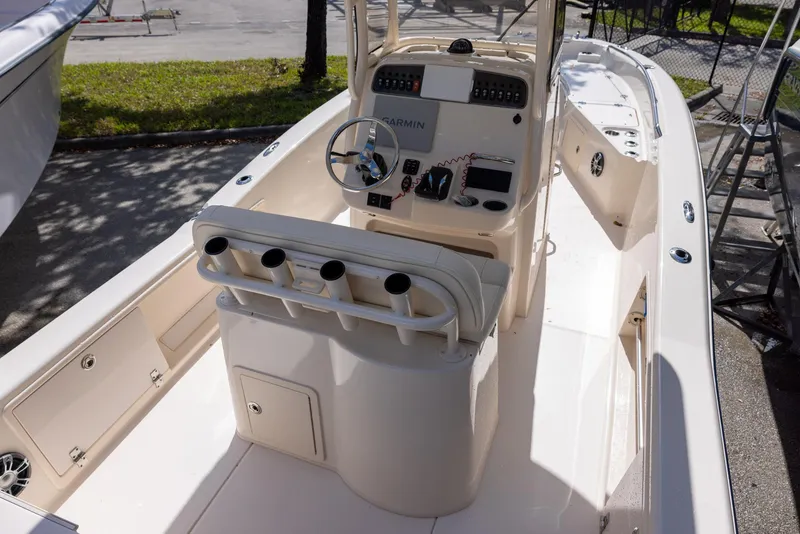 Slide: The Image of 2021 Grady-White 251 Coastal Explorer boat interior with helm and seating. - 4