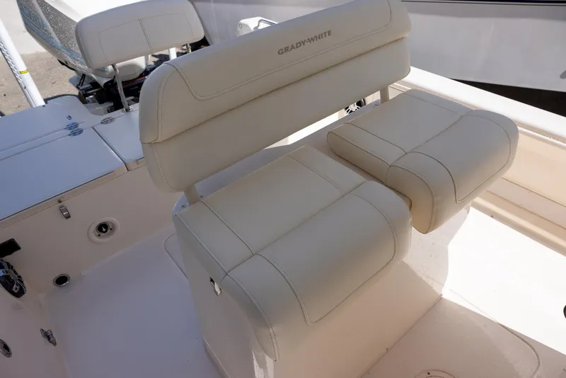 Slide: The Image of 2021 Grady-White 251 Coastal Explorer boat seating, featuring plush, cream-colored upholstery. - 6