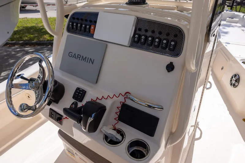 Slide: The Image of 2021 Grady-White 251 Coastal Explorer boat dashboard with Garmin navigation system. - 7