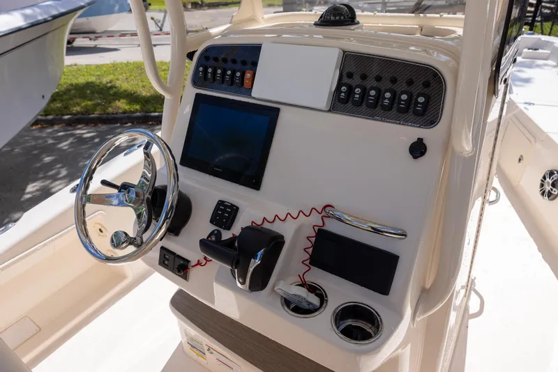 Slide: The Image of Control panel of 2021 Grady-White 251 Coastal Explorer boat with steering wheel and electronics. - 8