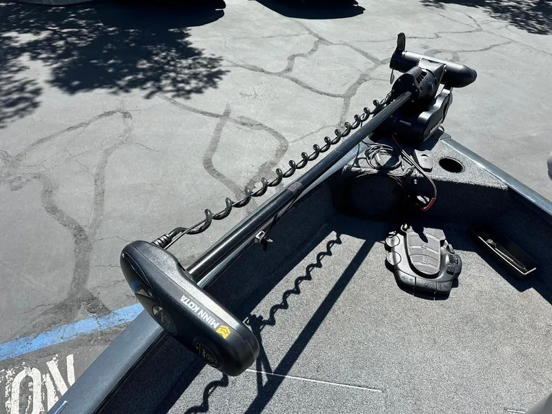 Slide: The Image of 2020 Tracker Pro Guide V-16 SC boat with Minn Kota trolling motor on deck. - 14