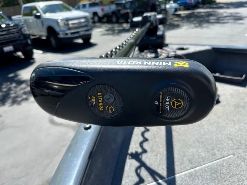 Slide: The Image of 2020 Tracker Pro Guide V-16 SC with Minn Kota trolling motor in parking lot. - 15
