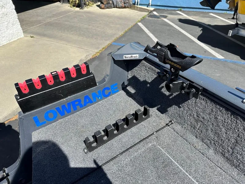 Slide: The Image of 2020 Tracker Pro Guide V-16 SC boat interior with Lowrance equipment and rod holders. - 22