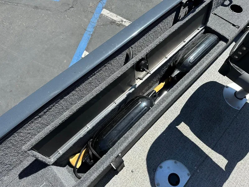 Slide: The Image of 2020 Tracker Pro Guide V-16 SC boat storage compartment with fenders and accessories. - 24