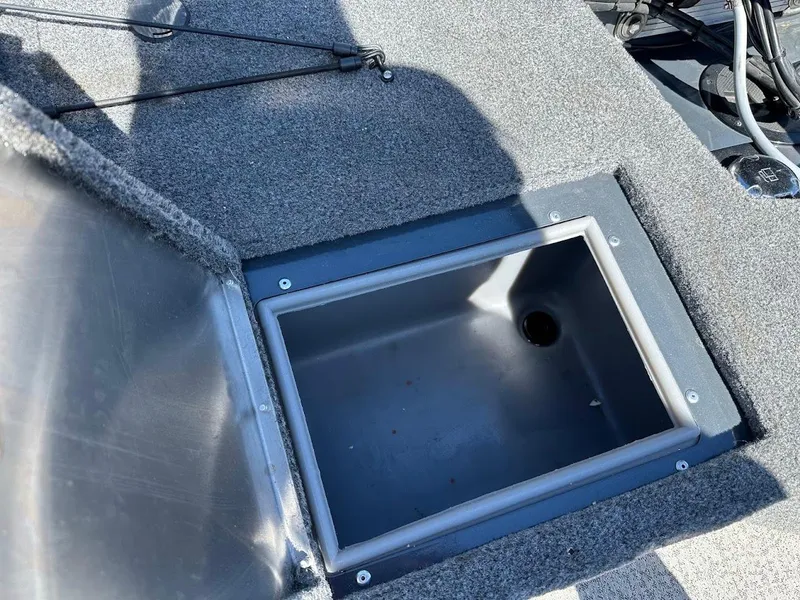 Slide: The Image of Open storage compartment on 2020 Tracker Pro Guide V-16 SC boat deck. - 26