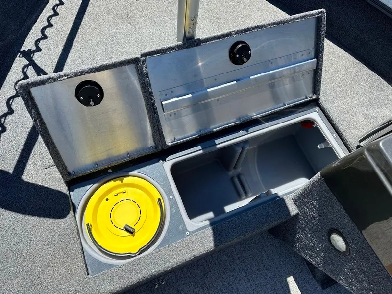 Slide: The Image of 2020 Tracker Pro Guide V-16 SC boat storage compartments with open lids. - 28