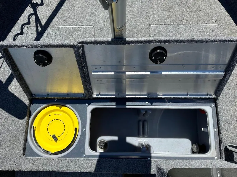 Slide: The Image of 2020 Tracker Pro Guide V-16 SC boat storage compartment with yellow lid and open hatch. - 29