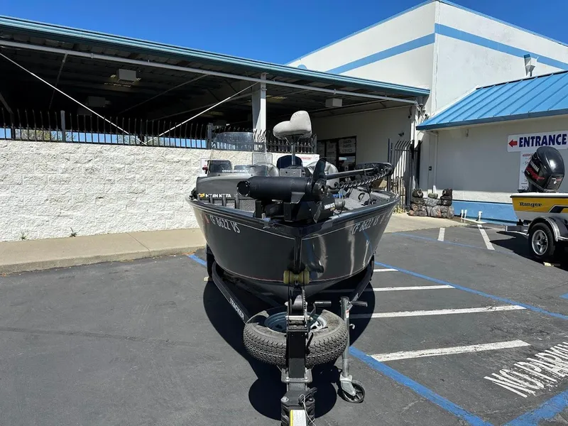 Slide: The Image of 2020 Tracker Pro Guide V-16 SC boat on trailer in parking lot. - 3