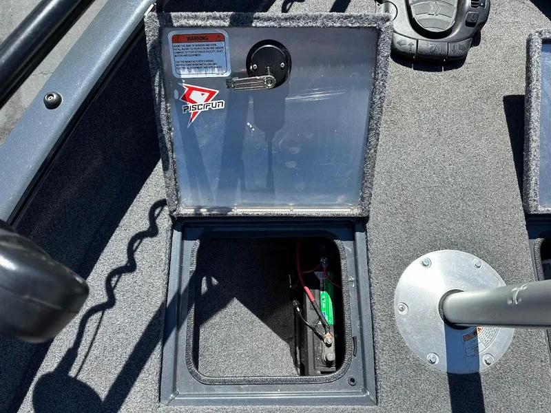 Slide: The Image of 2020 Tracker Pro Guide V-16 SC boat battery compartment with open hatch. - 30