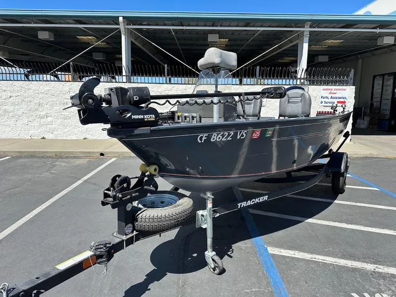 Slide: The Image of 2020 Tracker Pro Guide V-16 SC fishing boat on trailer in parking lot. - 4