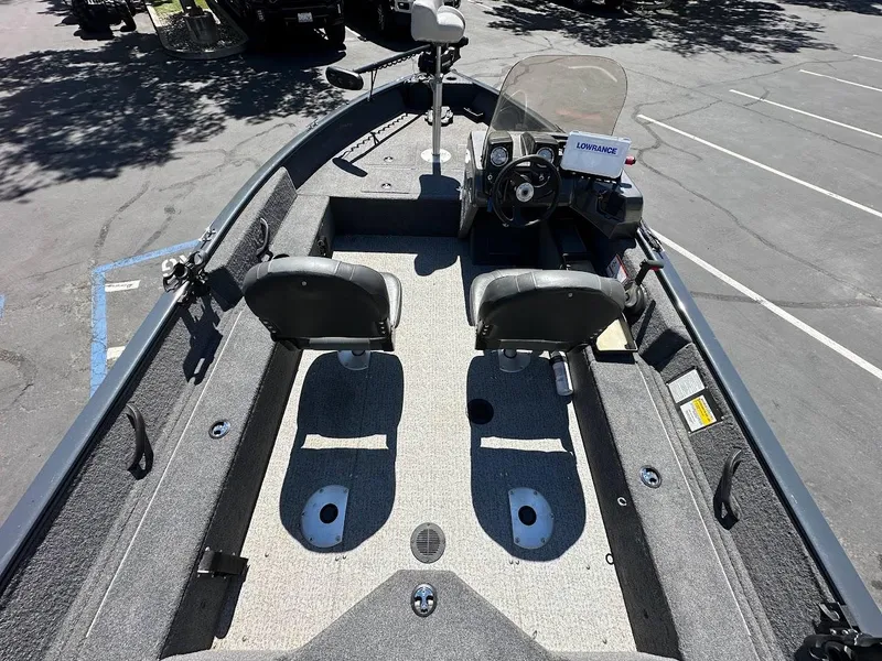 Slide: The Image of 2020 Tracker Pro Guide V-16 SC boat interior with seating and steering console. - 8
