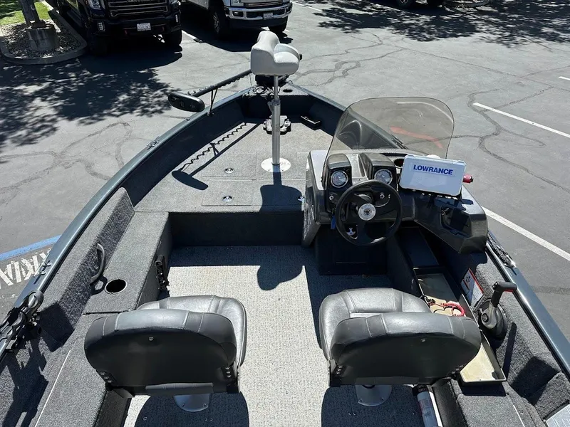 Slide: The Image of 2020 Tracker Pro Guide V-16 SC boat interior with steering console and seating. - 9