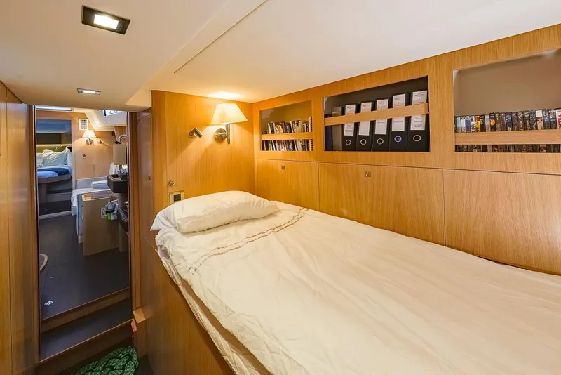 Slide: The Image of Cozy cabin interior of 2018 Amel 55 yacht with wooden finish and built-in storage. - 20