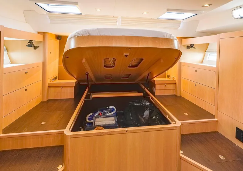 Slide: The Image of Amel 55 yacht interior, 2018 model, featuring under-bed storage in a spacious cabin. - 22