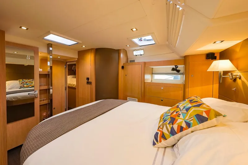 Slide: The Image of Luxurious cabin interior of 2018 Amel 55 yacht with cozy bed and modern decor. - 23