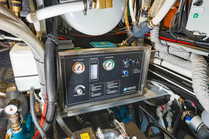 Slide: The Image of Engine room of a 2018 Amel 55 yacht, featuring control panel and gauges. - 30