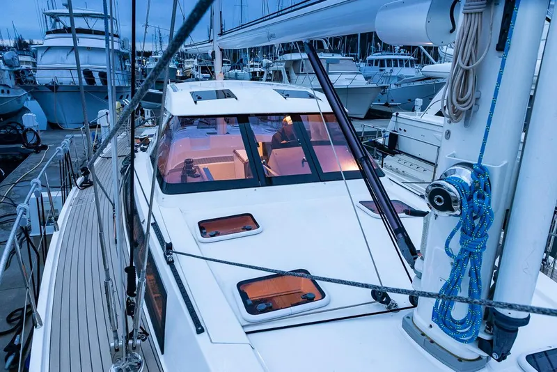 Slide: The Image of Amel 55 yacht, 2018 model, docked in a marina with visible deck and rigging. - 47