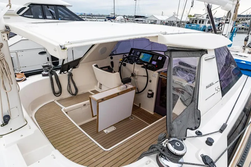 Slide: The Image of Cockpit of 2018 Amel 55 yacht with modern navigation equipment and seating. - 49