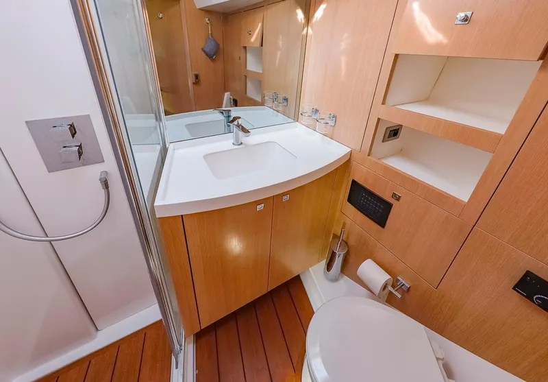 Slide: The Image of Modern bathroom in 2018 Amel 55 yacht with wooden cabinetry and sleek fixtures. - 5