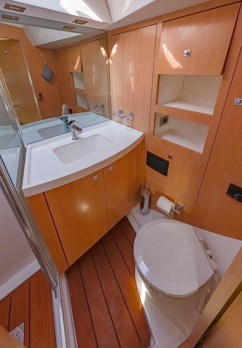 Slide: The Image of Modern bathroom in 2018 Amel 55 yacht with wooden cabinetry and sleek fixtures. - 6
