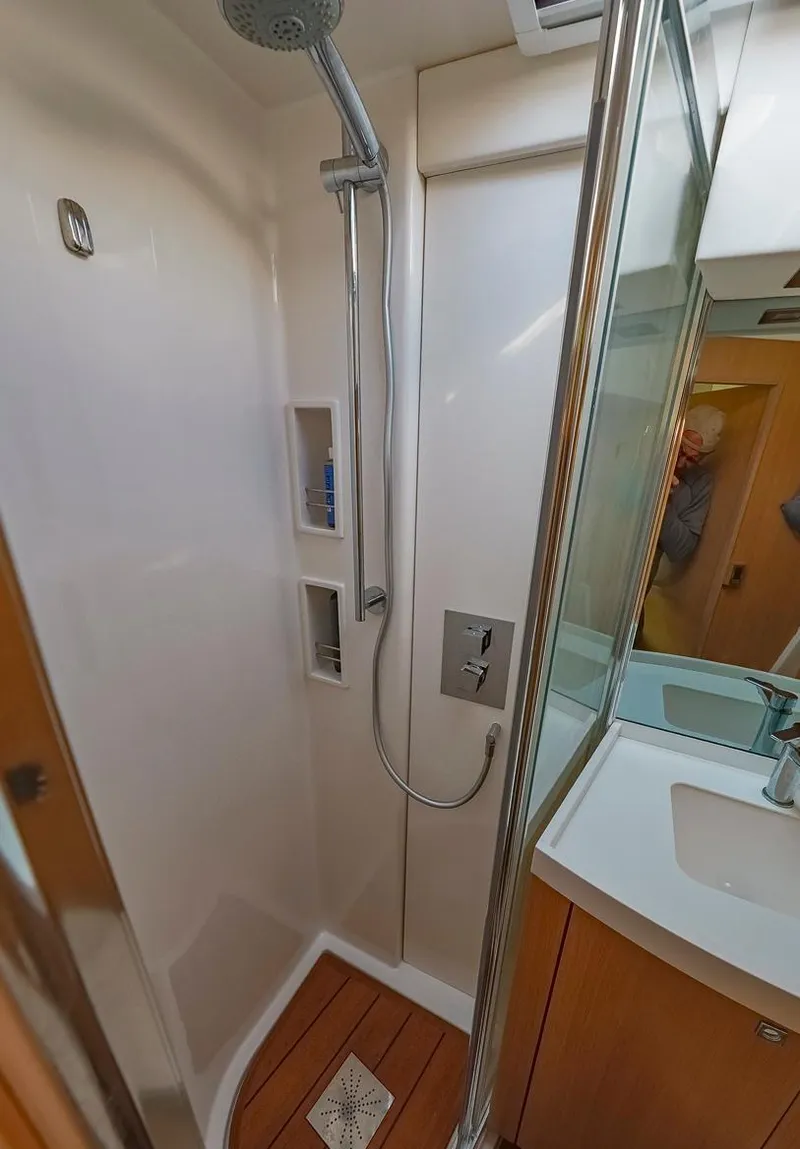 Slide: The Image of Modern shower area in a 2018 Amel 55 yacht with sleek fixtures and wooden flooring. - 7