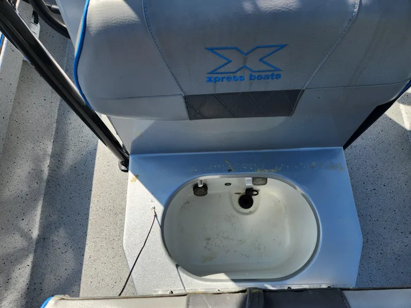 Slide: The Image of Xpress H22B 2022 boat seat with integrated storage compartment, featuring blue accents. - 15