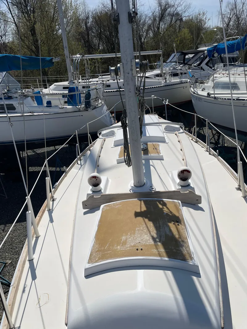 Slide: The Image of 1979 Bristol 32 sailboat deck view with surrounding boats in marina. - 12