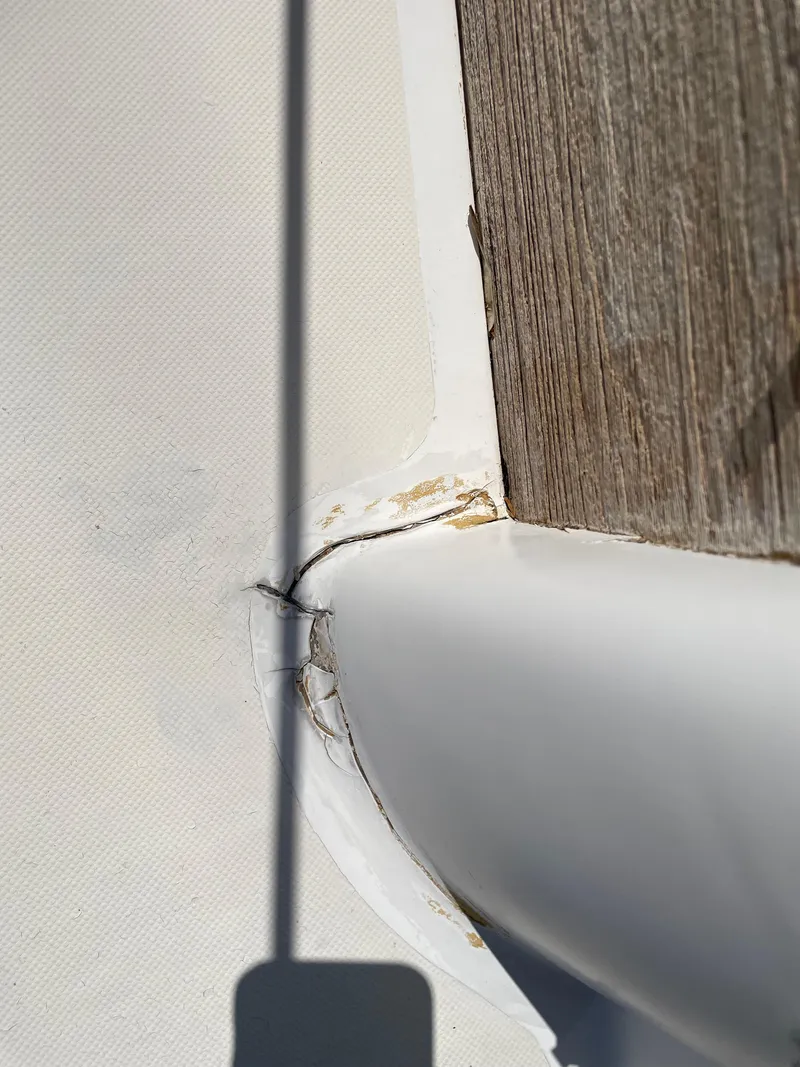 Slide: The Image of Close-up of a 1979 Bristol 32 boat deck showing a joint and shadow. - 15