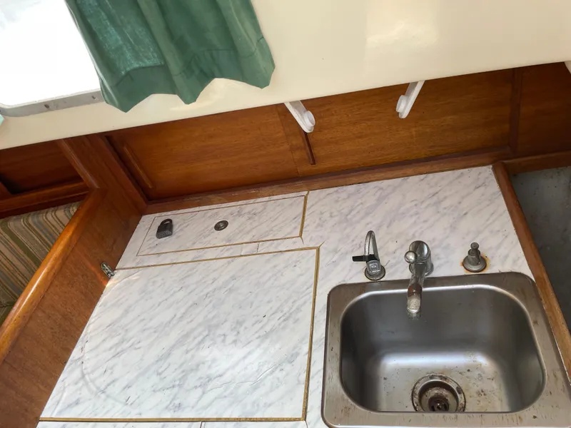 Slide: The Image of 1979 Bristol 32 yacht kitchen with sink and countertop. - 17
