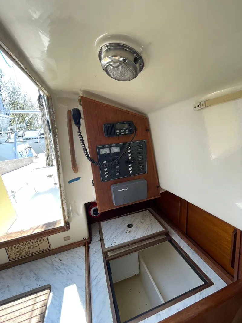Slide: The Image of 1979 Bristol 32 yacht interior with navigation equipment and storage compartments. - 21