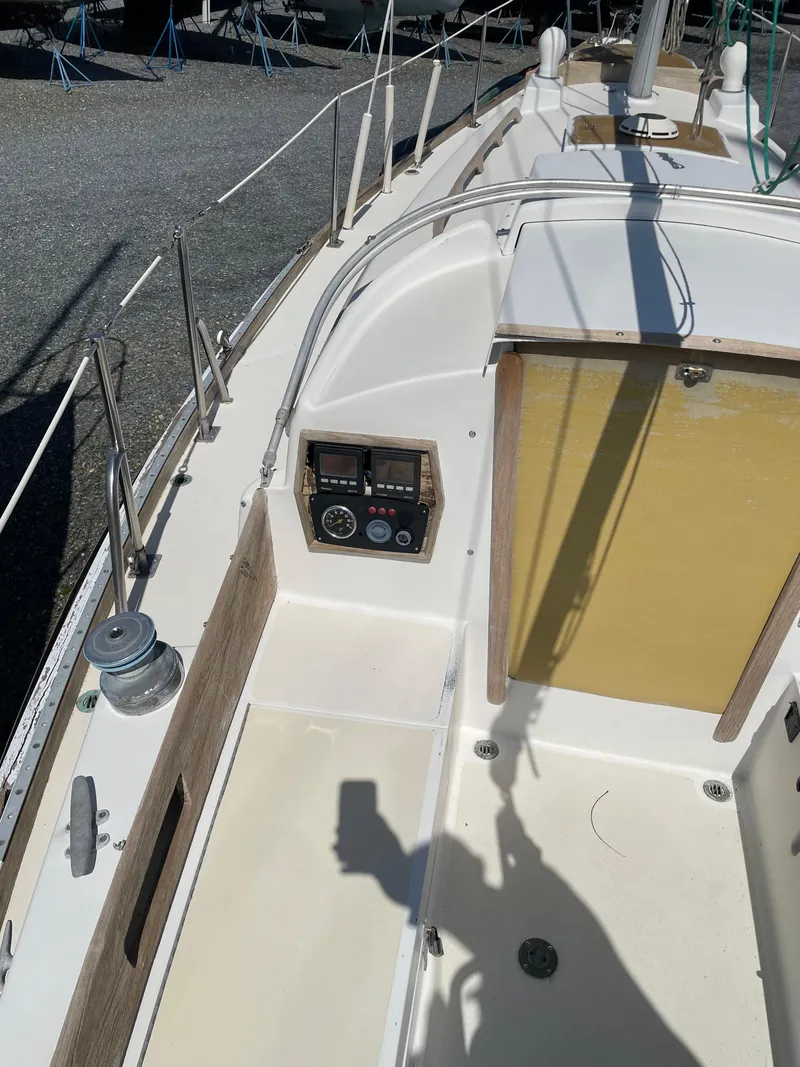 Slide: The Image of 1979 Bristol 32 sailboat cockpit with control panel and winch. - 9