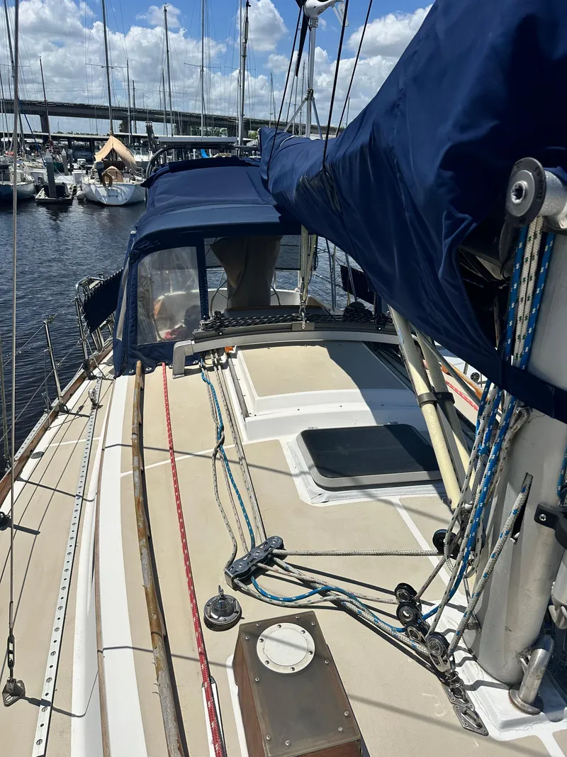 Slide: The Image of 1988 Cape Dory 30 MK II sailboat docked, featuring deck and rigging details. - 18