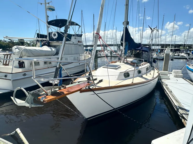 Slide: The Image of 1988 Cape Dory 30 MK II sailboat docked at marina under clear blue sky. - 3